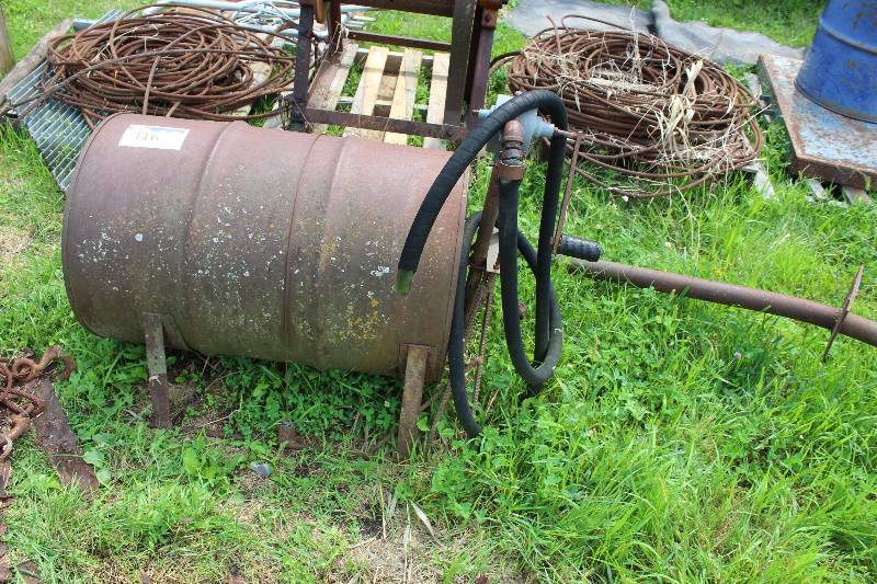 lot 116 image: Metal Drum wStand & Pump Hose 34 x 22.5 x 25.