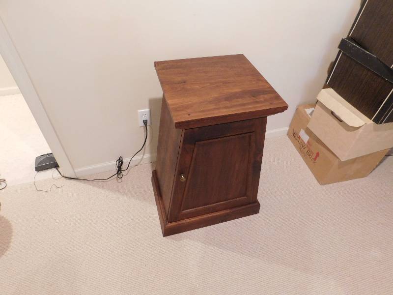 lot 14 image: pryamid shaped cabinet with one shelf inside compliments item number 10