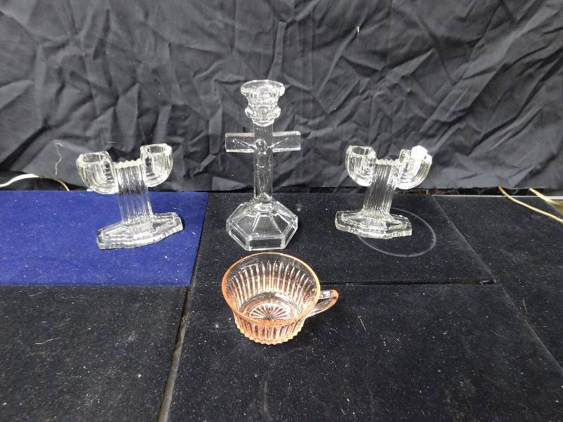 lot 28 image: glass candle holders religious one with Jesus and pink depression glass cup