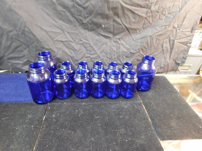lot 33 image: cobalt bottles 10-200ml bottles and 3-500ml bottles