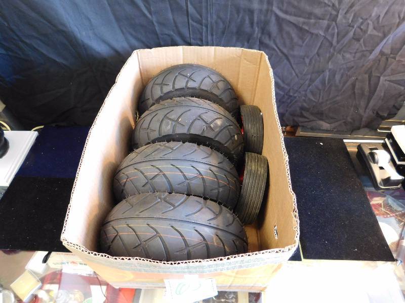 lot 65 image: 4 new pneumatic tires and 2 new hard tires