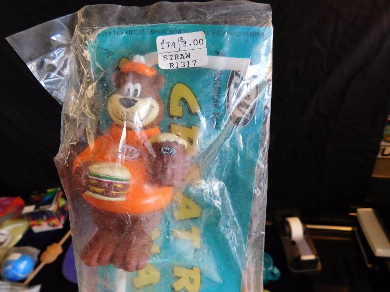 lot 73 image: many A&W collectible items figurine, drinking straws, hats, toys from kids meals and more