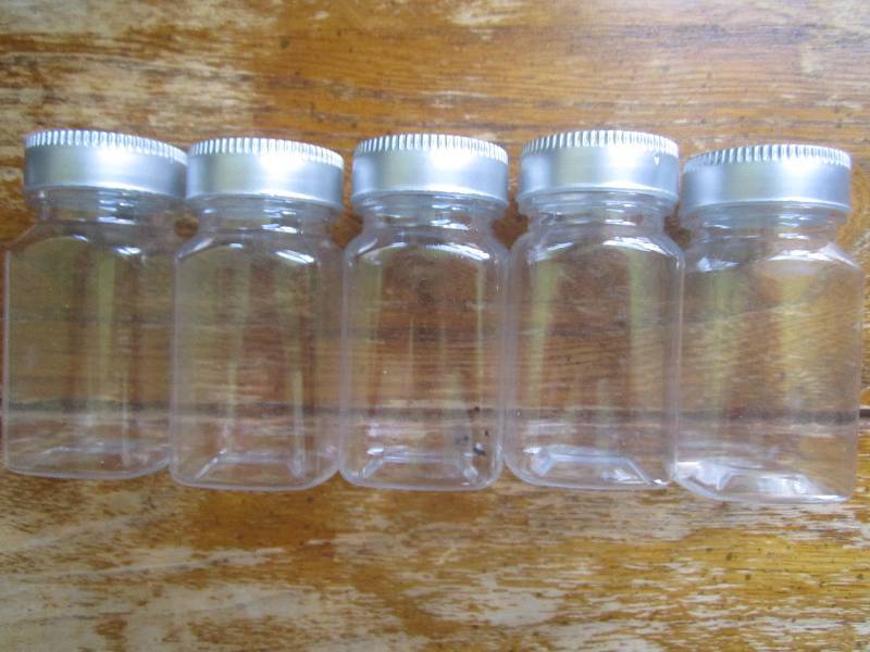 lot of 5 small clear bottles ...