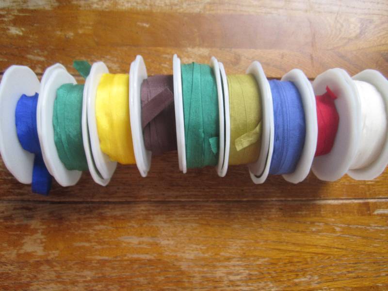 lot of 9 basic colored ribbon spool...