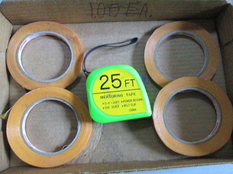 4 rolls of tape and a 25 tape meas...