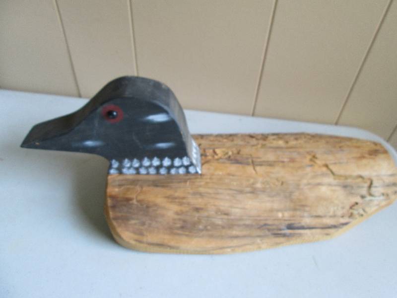 Rustic loon made from old fence pos...