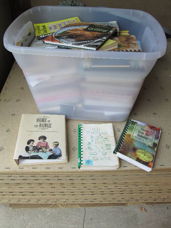 large plastic bin full of cook book...