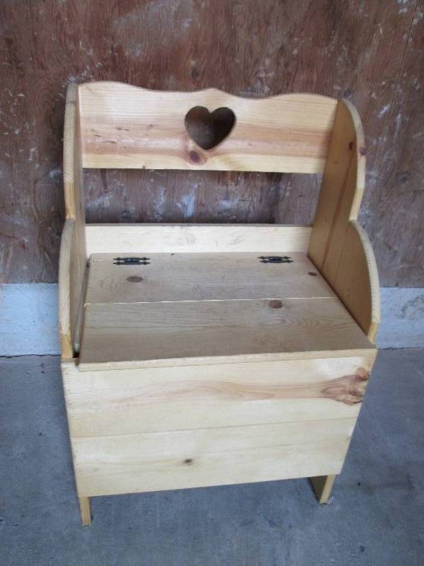 wooden bench with heart cut out on ...