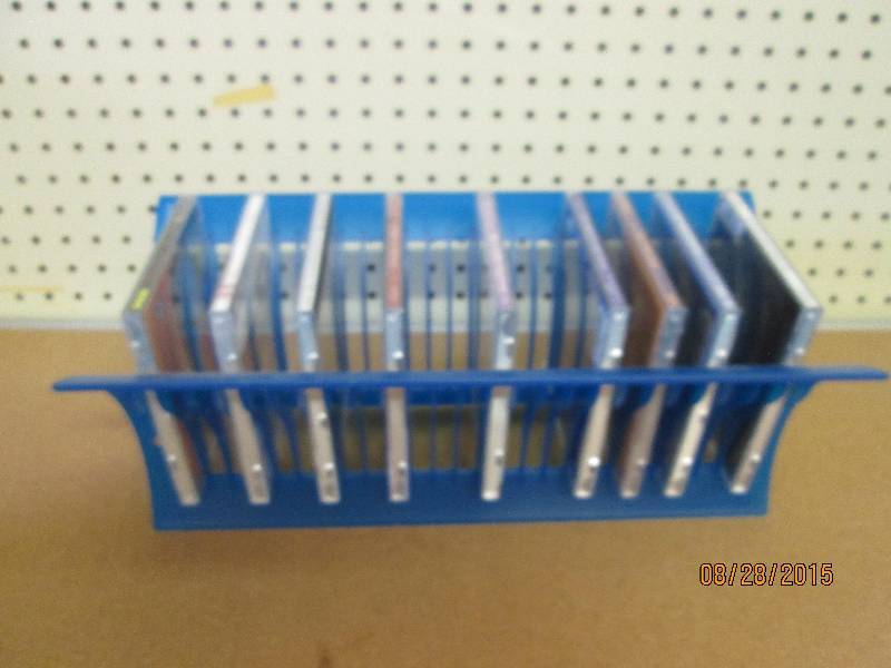 9 CDs with 12 disk storage containe...