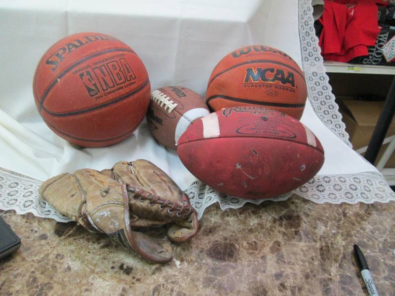 lot 21 image: Basketballs, football, and softball...
