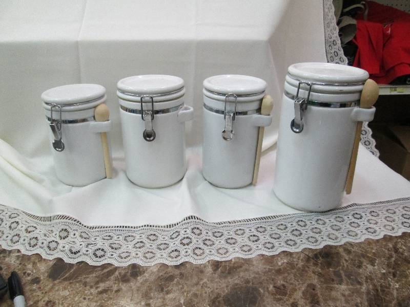 lot 23 image: Qty 4 different sealed canisters...