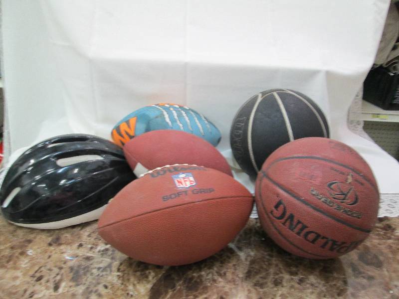 lot 62 image: Basket ball, football, and bike hel...