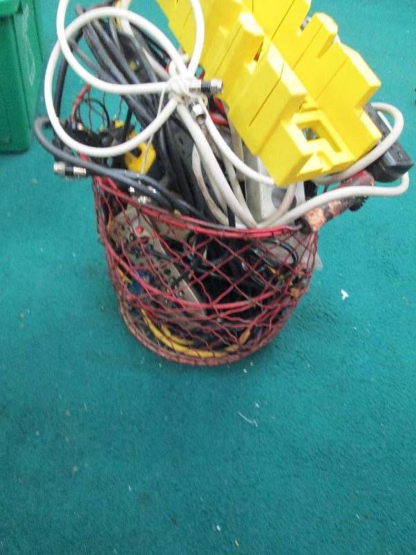 lot 65 image: Basket full of plug in strips and d...