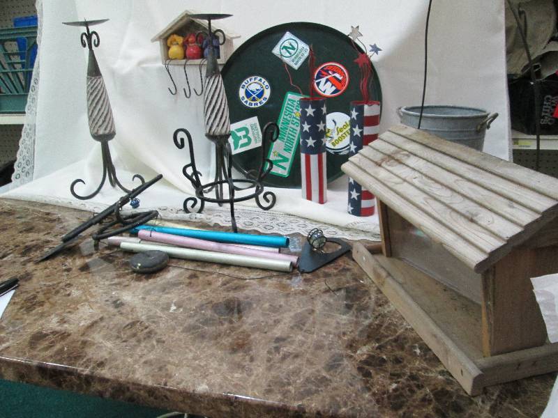 lot 66 image: Candle holder, wind chime, bird hou...