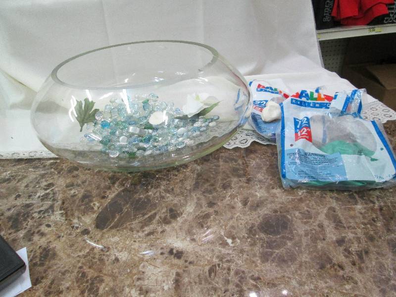 lot 69 image: A big glass bowl with different col...