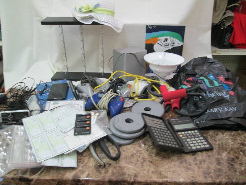 lot 74 image: Old cell phones, weights, game cont...