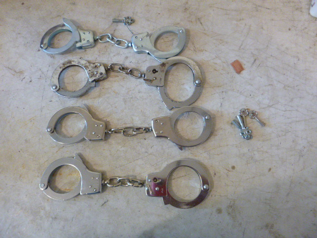 lot 28 image: 4 Sets of Handcuffs
