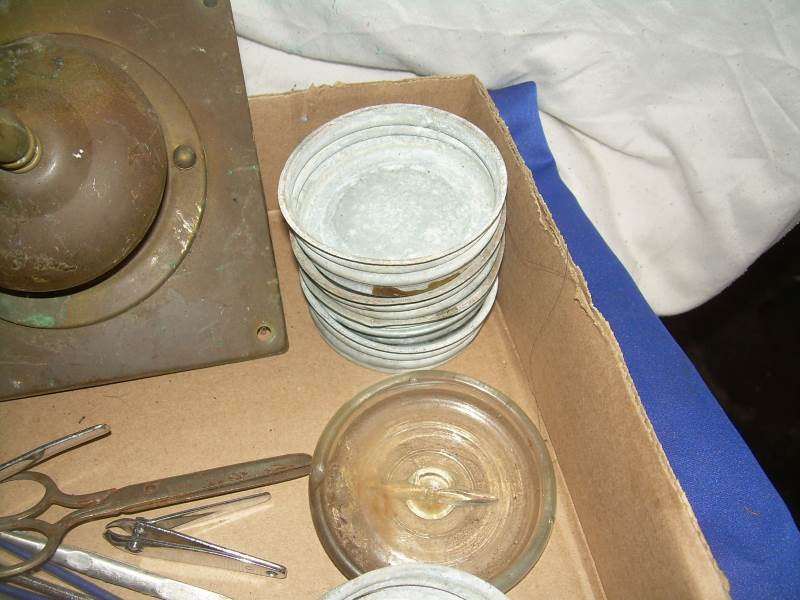 box of vintage jar covers and misc