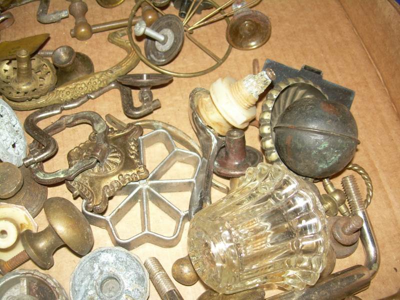 box of vintage knobs and brackets