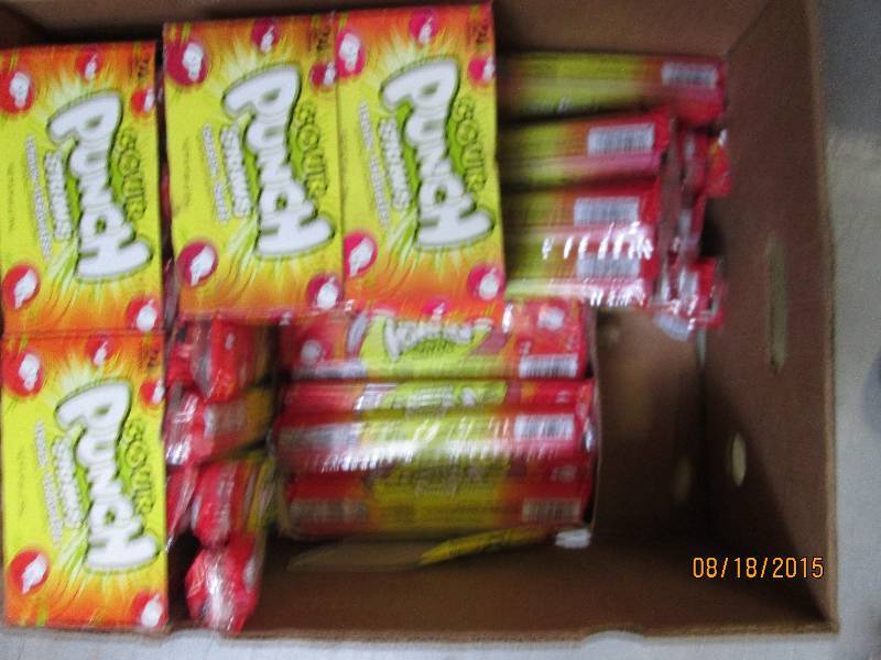 6 cases of sour punch straws charg...