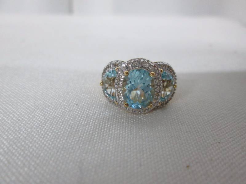 lot 67 image: 18K Gold Plated 3-Stone Sky Blue Topaz Ring