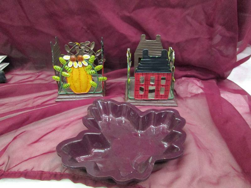 Two candle holders with pumpkins, h...