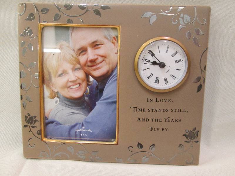 Picture frame with clock and say In...