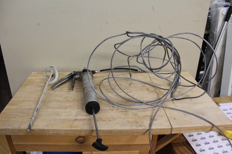 lot 310 image: Grease Gun, Paint Stirrer, and Wire Cable w Hook