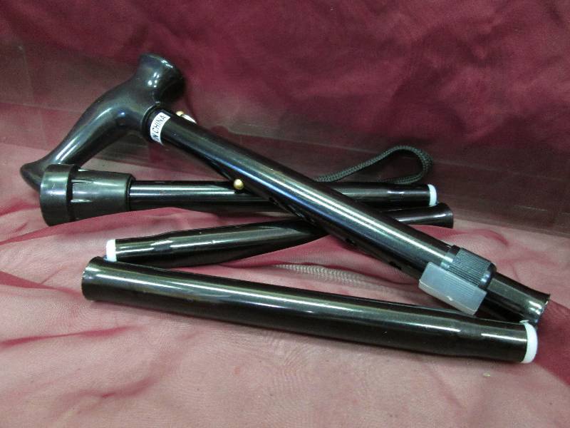 black adjustable folding cane...
