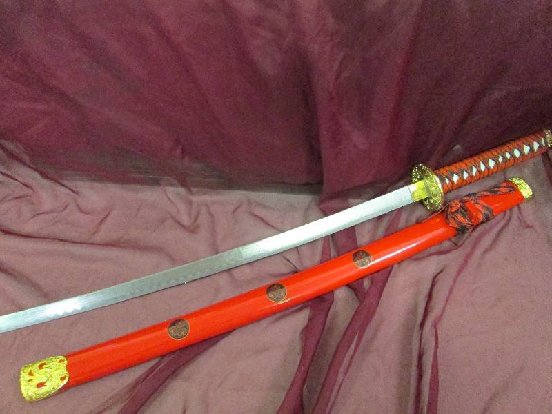Long Red handle sword with red cove...