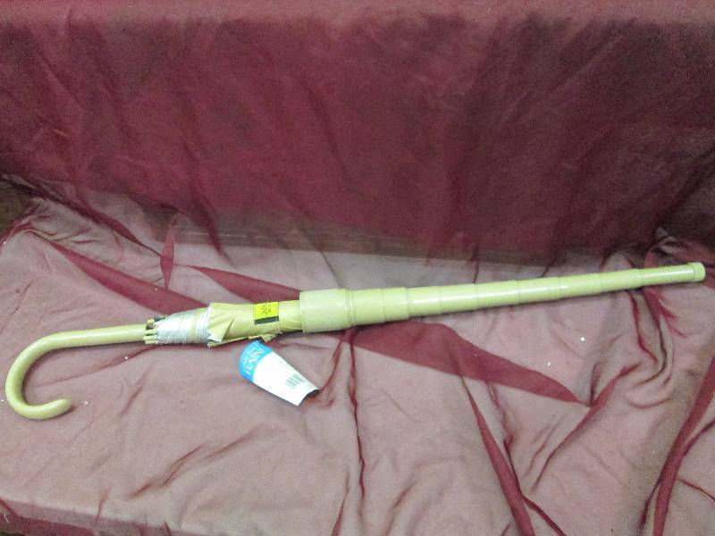 beige umbrella with cover...