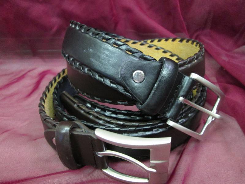 one mens black belt with siver buck...