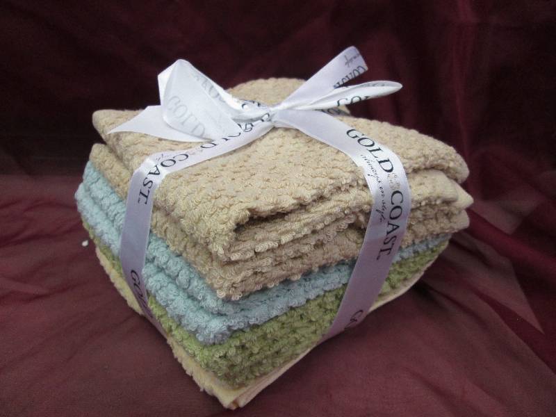 set of 8 washclothes- 2 tan, 2 blue...