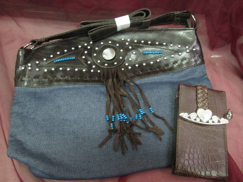brown and denium purse with a brown...