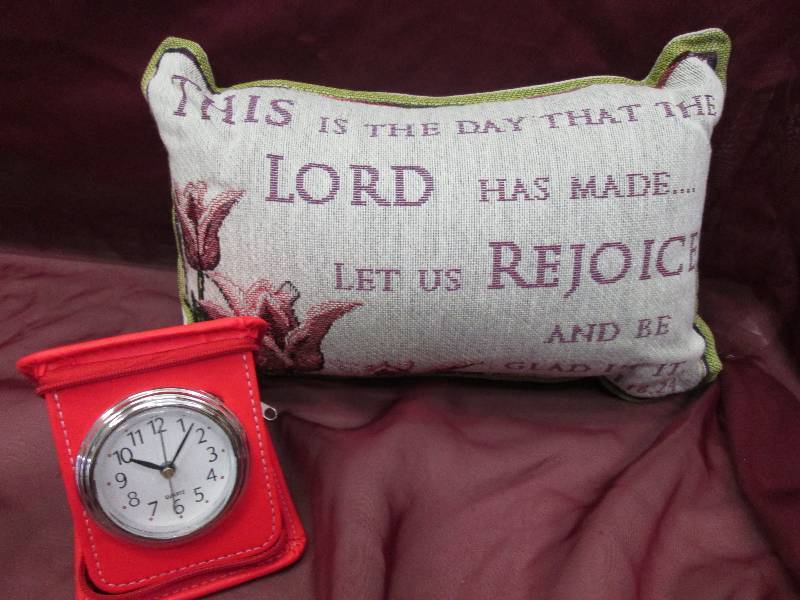 decorative pillow and a portable cl...