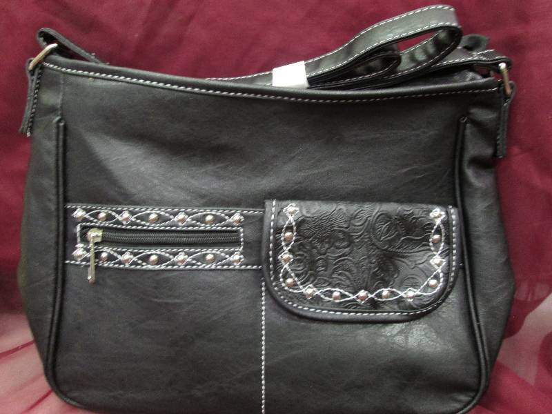 black purse with silver accents an...