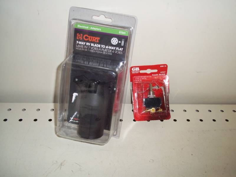 lot 55 image: New 7 way RV Blade to 4 way adapter and switch