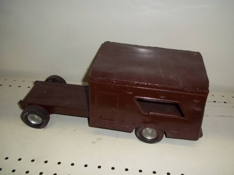 lot 92 image: Toy truck part Brown metal