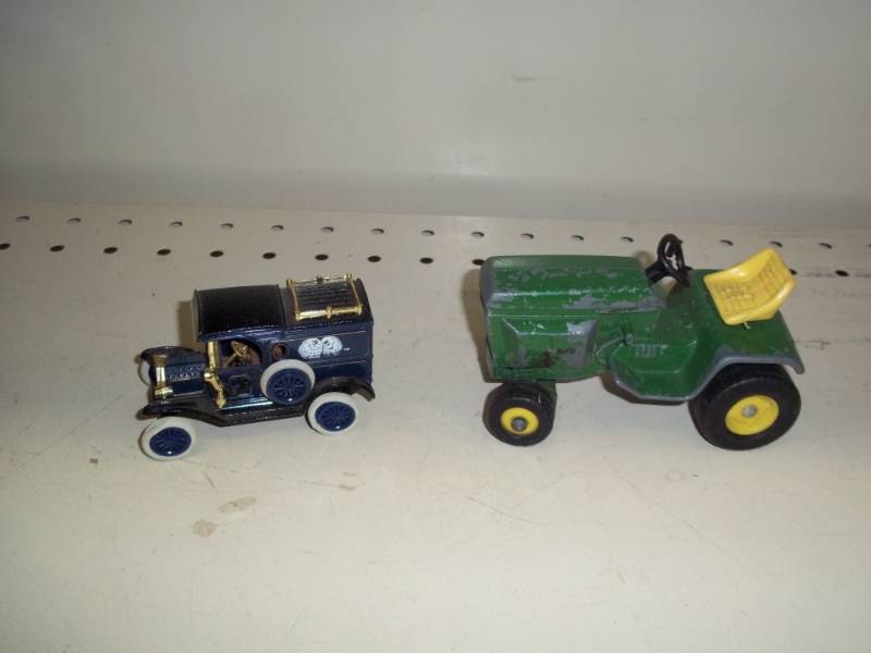 lot 93 image: Toy car and toy lawnmower