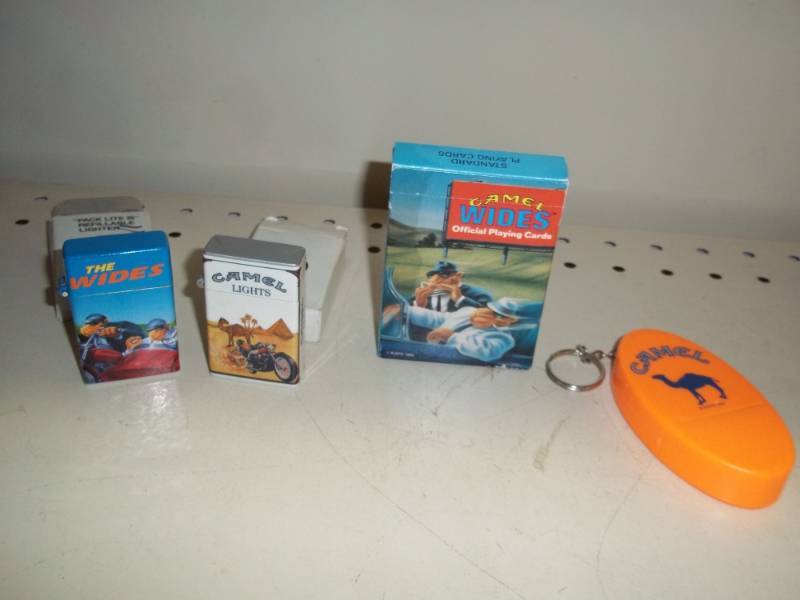 lot 132 image: Camel lighters with cards and key chain