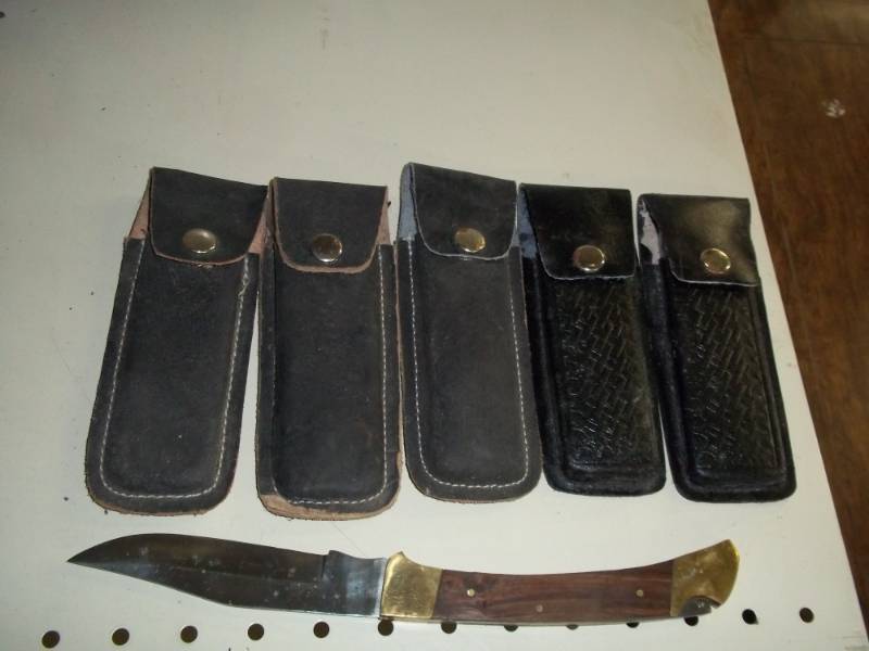 lot 176 image: 5 lock back knives with leather sheath