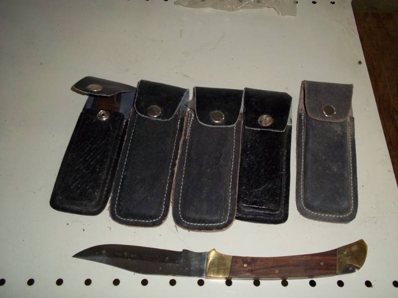 lot 179 image: 5 lock back knives with leather sheath