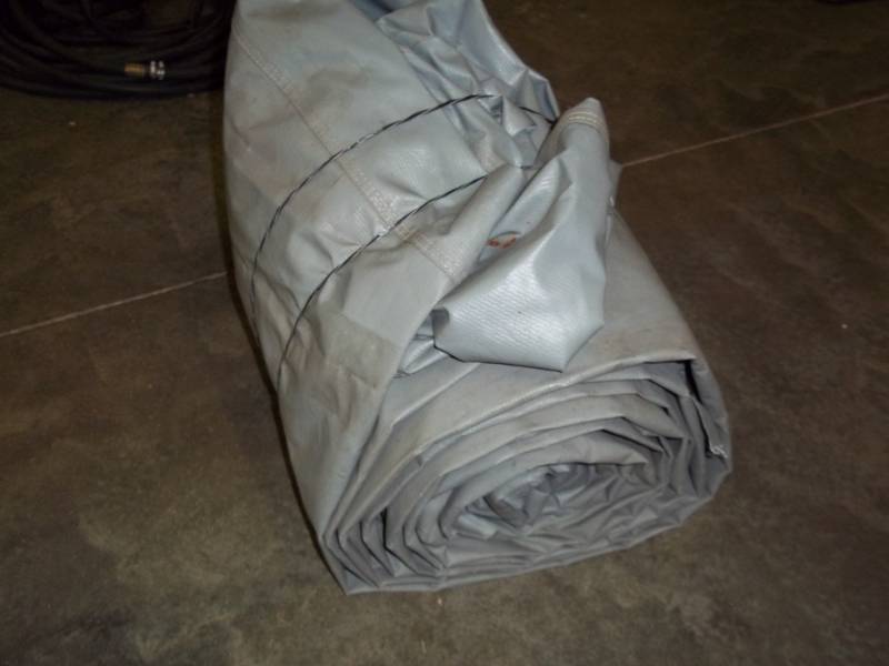 lot 233 image: Large Tarp good for wood pile may have some holes and rips
