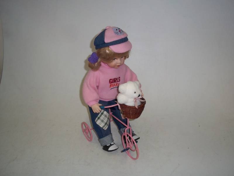 lot 236 image: 17 in Porcelain Doll with Bicycle