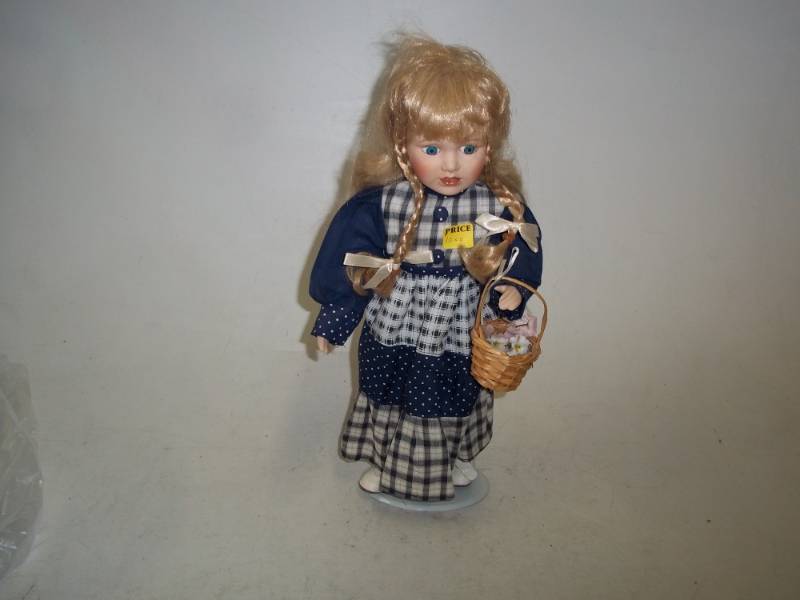 lot 238 image: 16 in Porcelain Doll with Stand