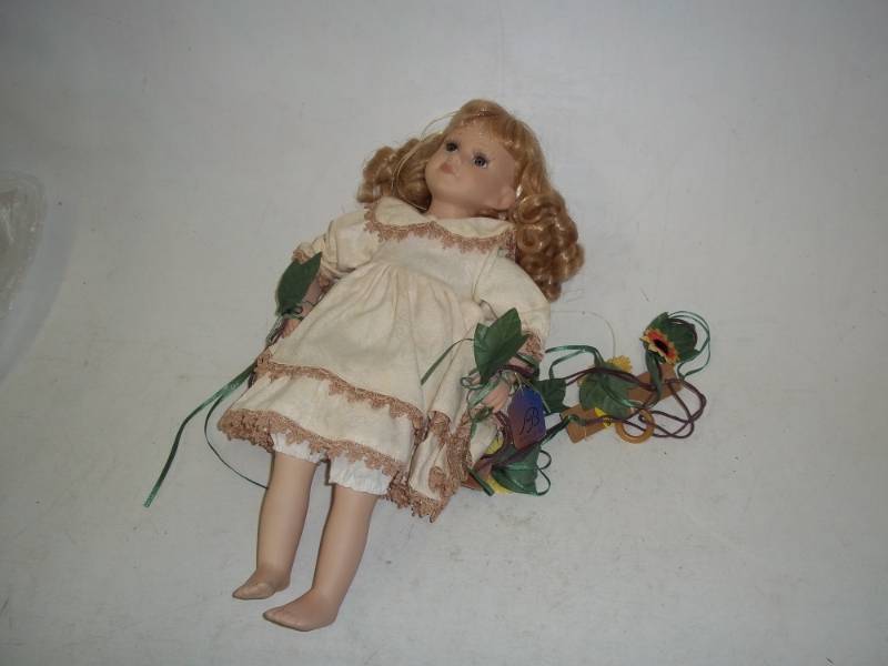lot 240 image: 16 in Porcelain Doll with swing
