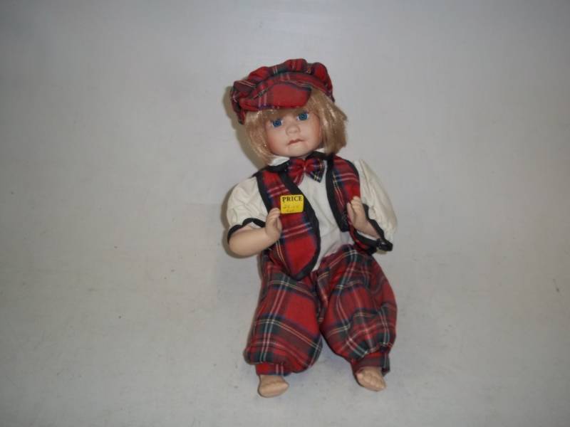 lot 242 image: 12 in Porcelain Doll