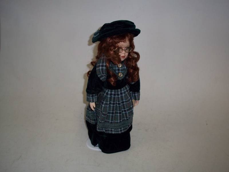 lot 244 image: 17 in Porcelain Doll with Stand