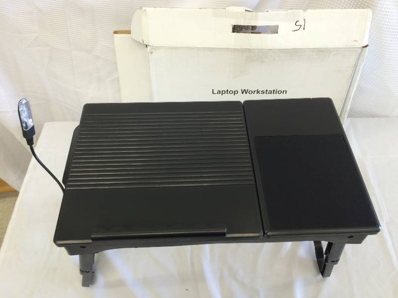 black adjustable laptop workstation with light