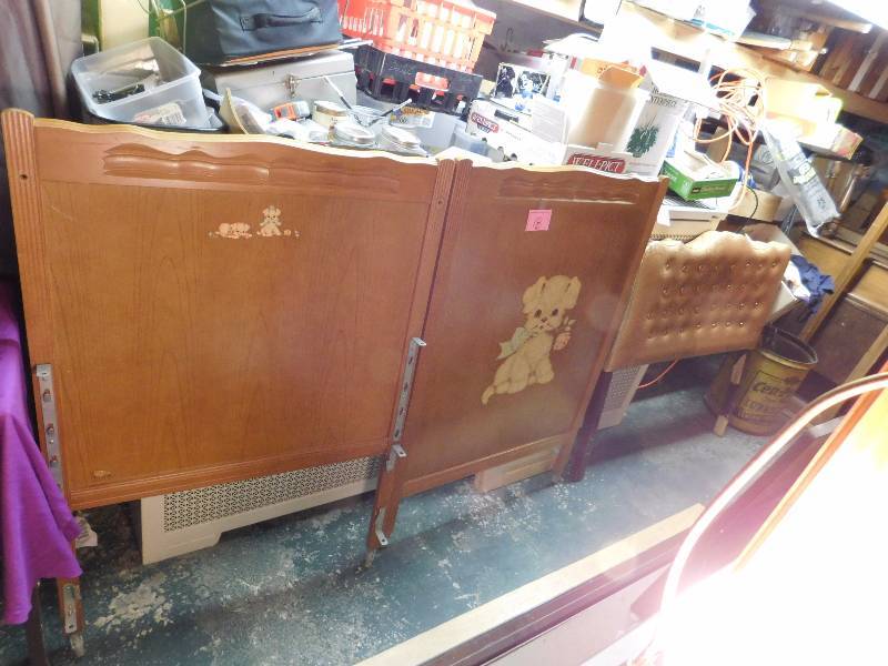 headboard and footboard of vintage crib see the decals